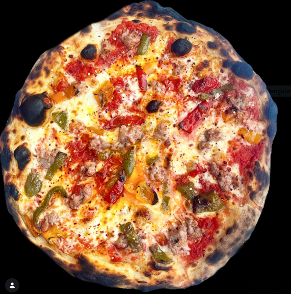 Round pizza with sausage, roasted peppers and olives
